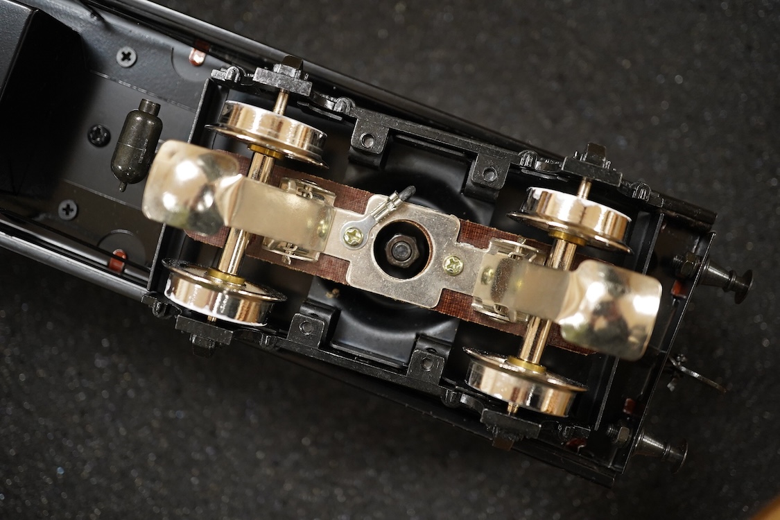 A boxed 0 gauge Darstaed tinplate Metropolitan Railway set of bogie coaches, a rake of five coaches in teak livery including; two Brake Thirds, two Full Thirds, and a Full First, fitted with internal lighting throughout